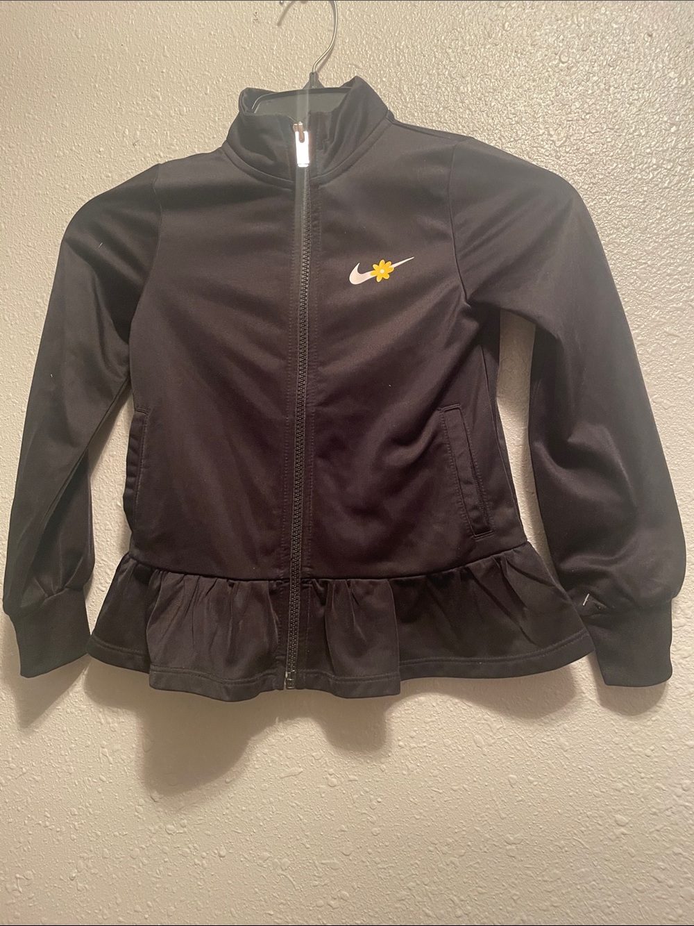 Nike Kids Black Zip Jacket with Yellow Flower Logo